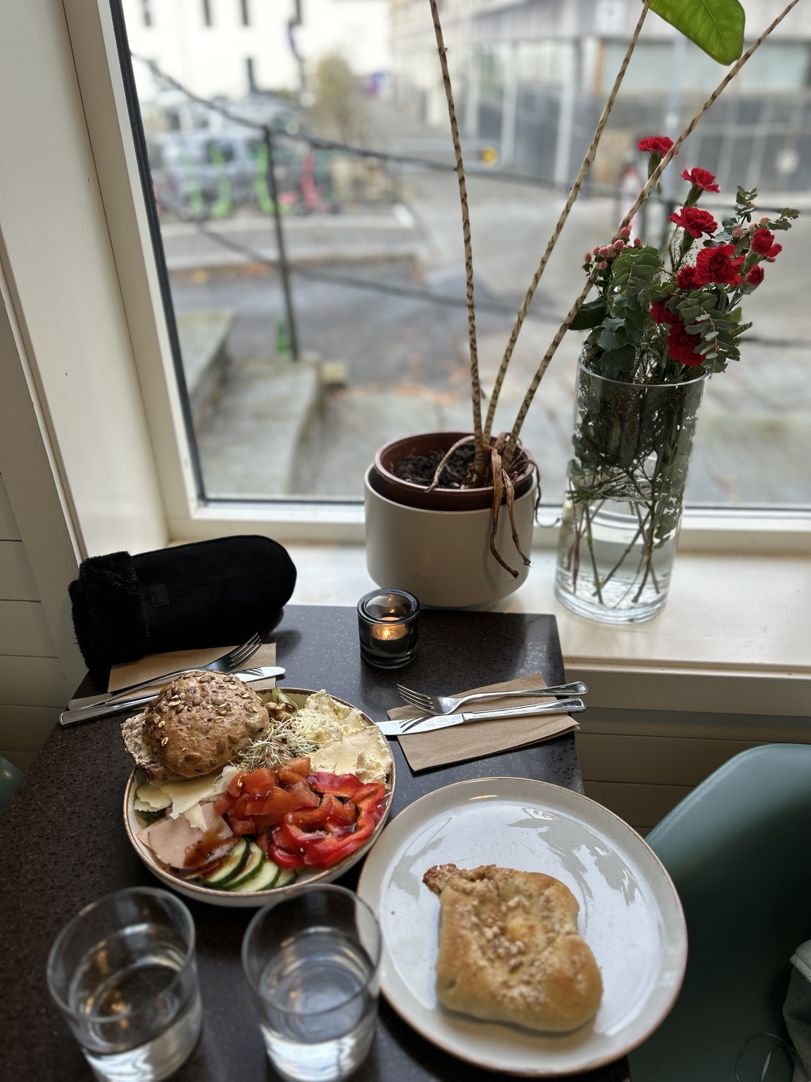 Godt Brød breakfast with fresh bread and pastry by the window