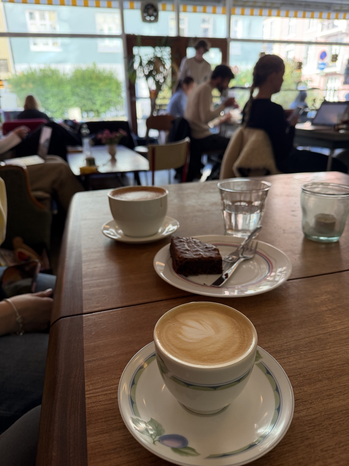Coffee and chocolate cake inside Nobel Bopel in Bergen